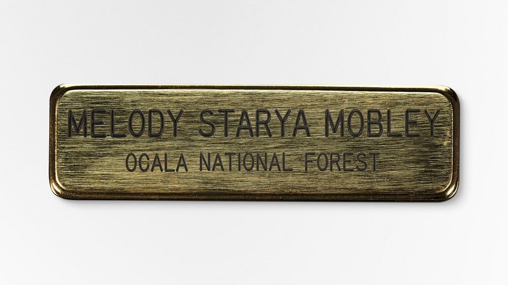 US Forest Service Ocala National Forest name badge worn by Melody Starya Mobley. Original public domain image from The…