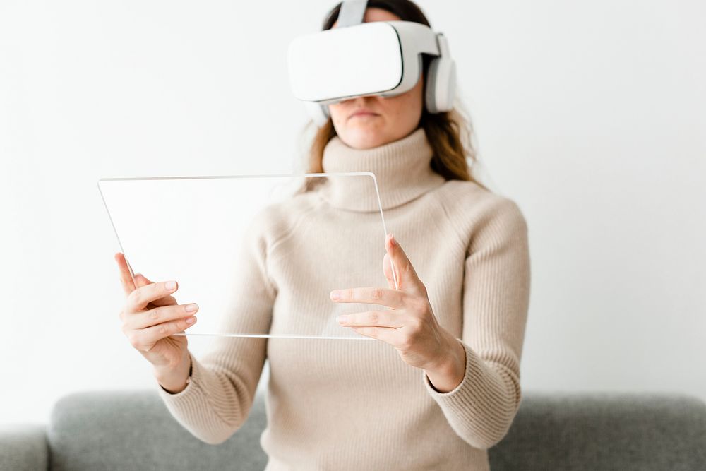 Woman with transparent tablet mockup psd and VR headset psd entertainment technology