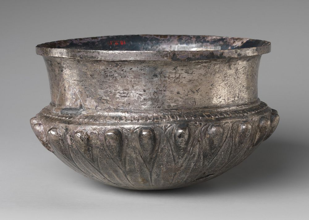 Bowl with acorn bosses at shoulder, lotus pattern beneath, and rosette on bottom, and with inscribed weight