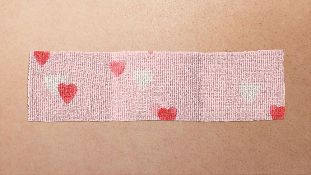 Heart patterned pink band aid