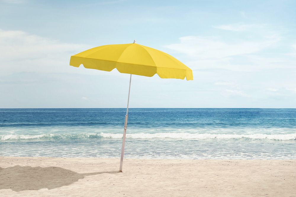 Yellow beach umbrella on sunny day