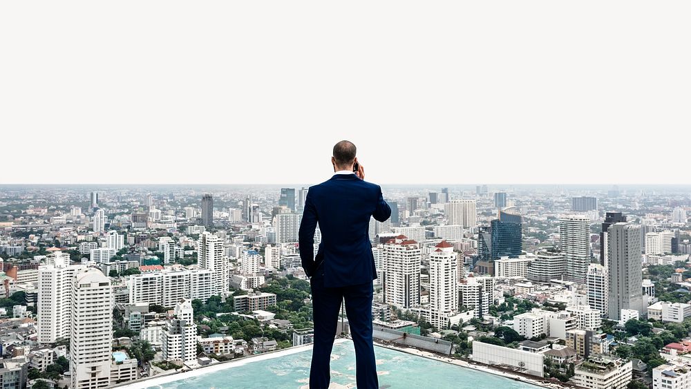Business man talking on a phone with a cityscape image element
