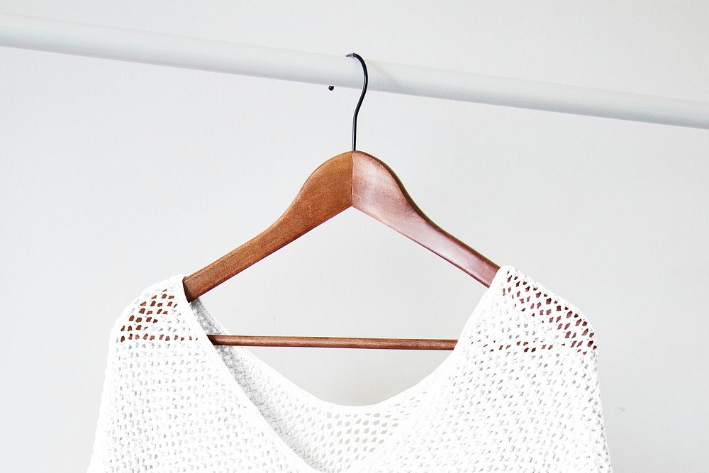 Knitted poncho mockup, wooden hanger psd