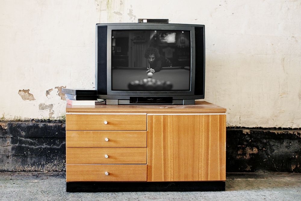 CRT TV on wooden cabinet