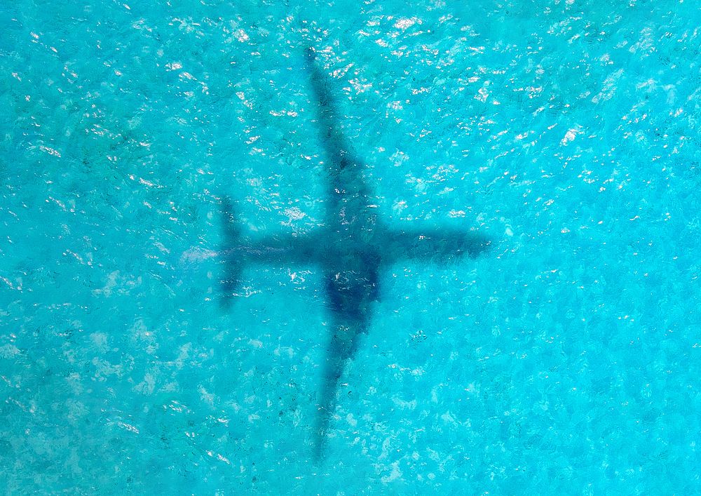 Plane shadow on ocean background