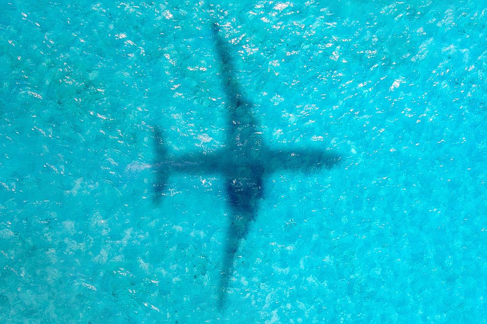 Plane shadow on ocean background