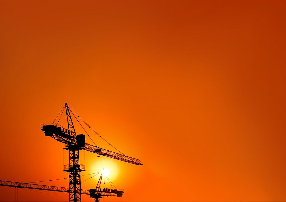 Construction crane, orange background