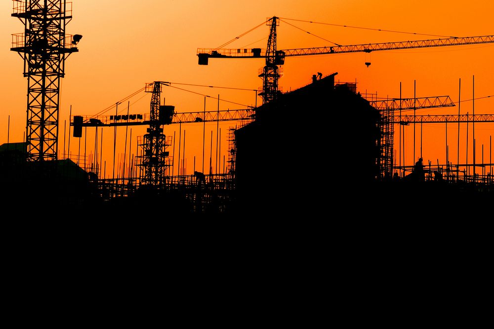 Construction silhouette, orange background