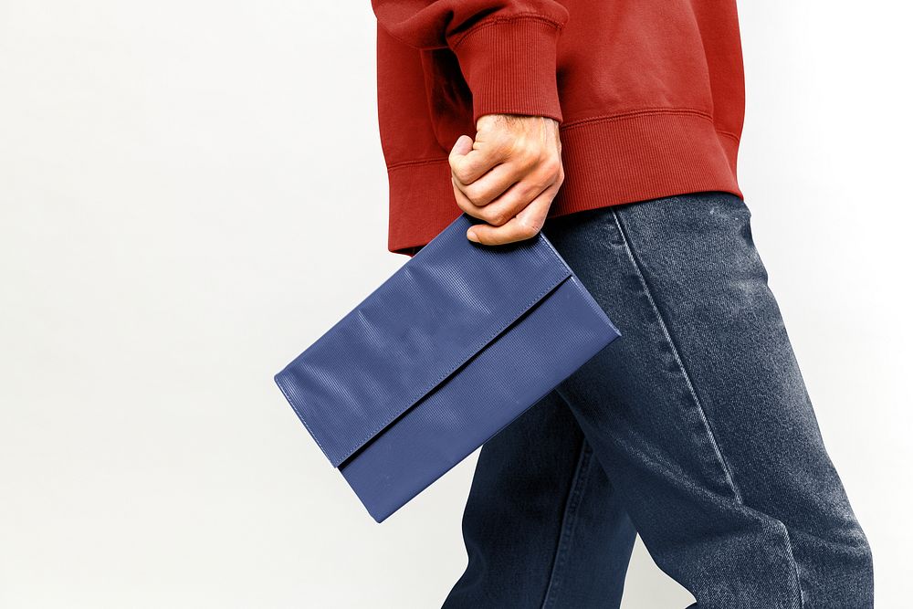 Man holding blue purse