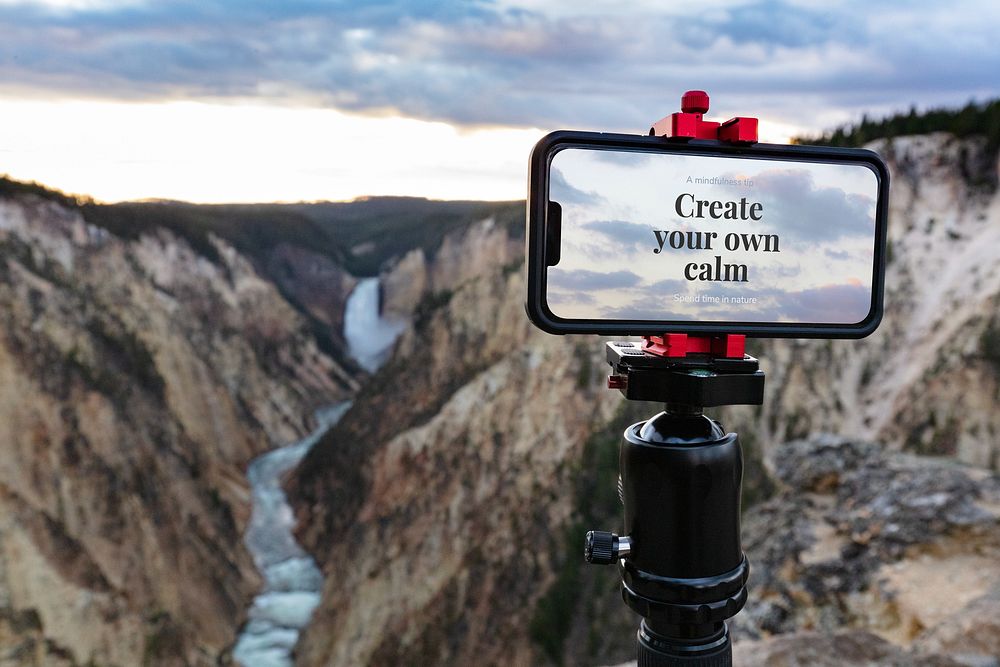Phone on tripod with inspirational message