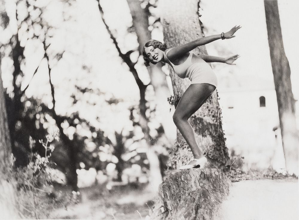 Woman in Swimsuit in Diving Pose on Treestump (1920) vintage photograph. Original public domain image Saint Louis Art…