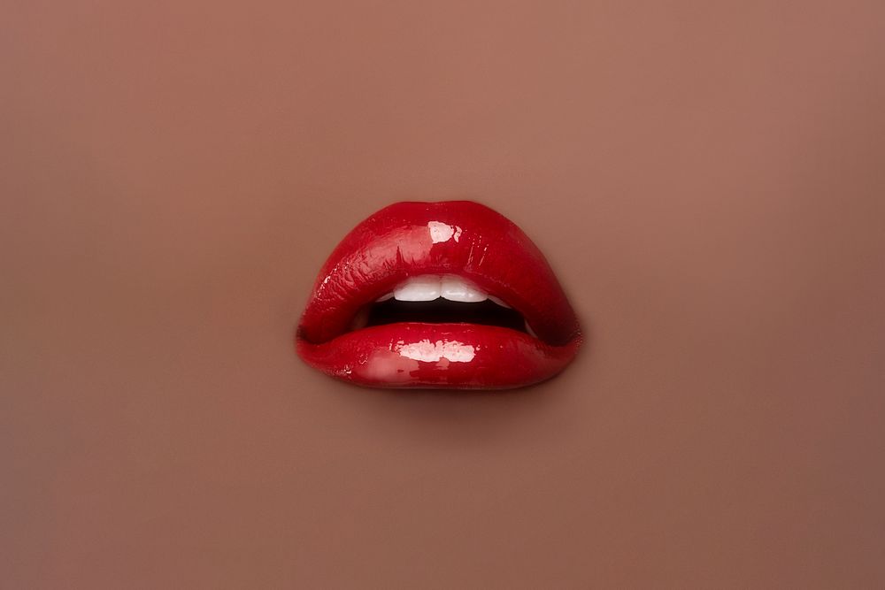 Woman's red lips brown background