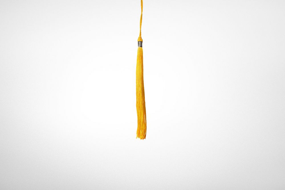 Yellow tassel background, graduation cap image