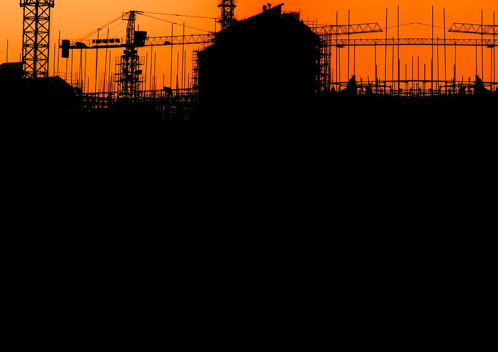 Construction silhouette, orange background