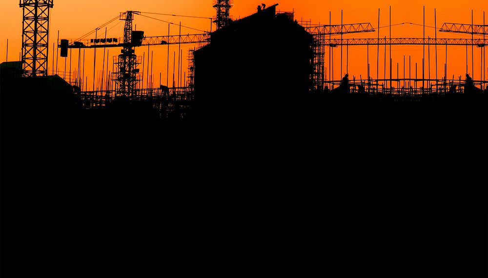 Construction silhouette, orange background