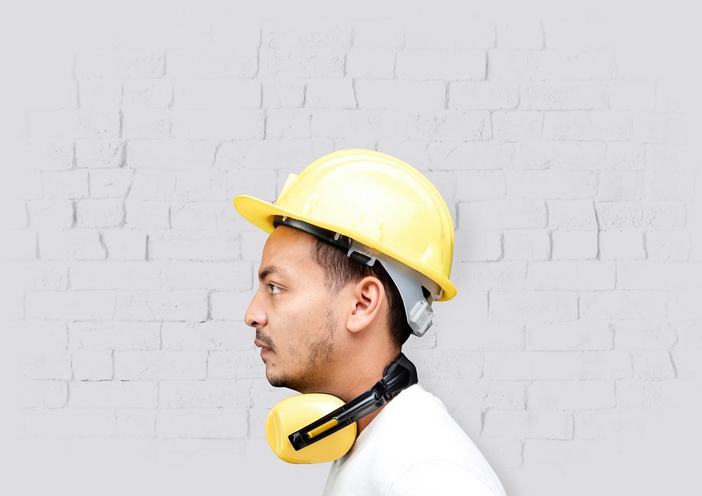 Man with safety helmet, yellow PPE