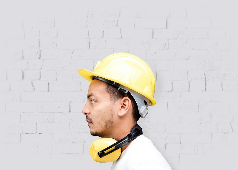 Man with safety helmet, yellow PPE