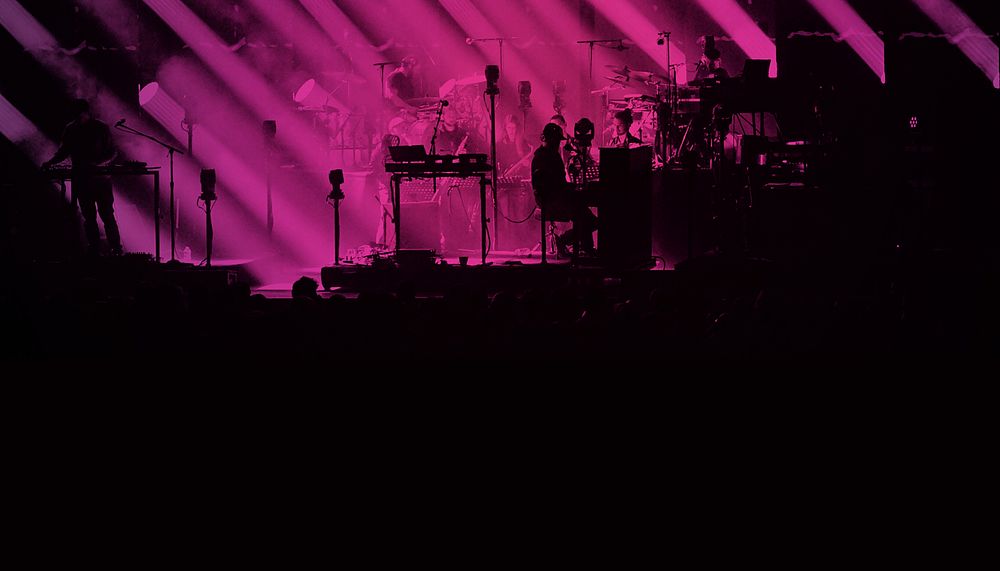 Silhouette concert, pink light background