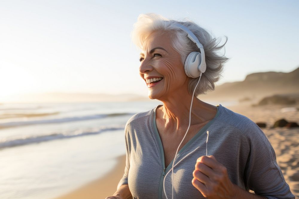 Happy senior woman jogging at a beach AI generated image
