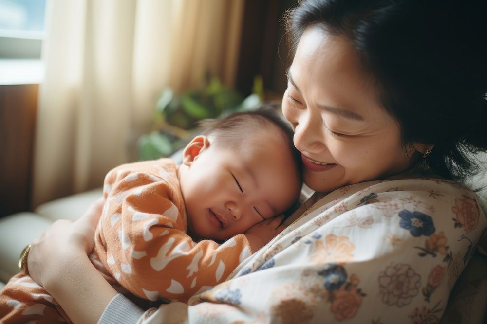 Asian baby sleeping on mom's chest AI generated image