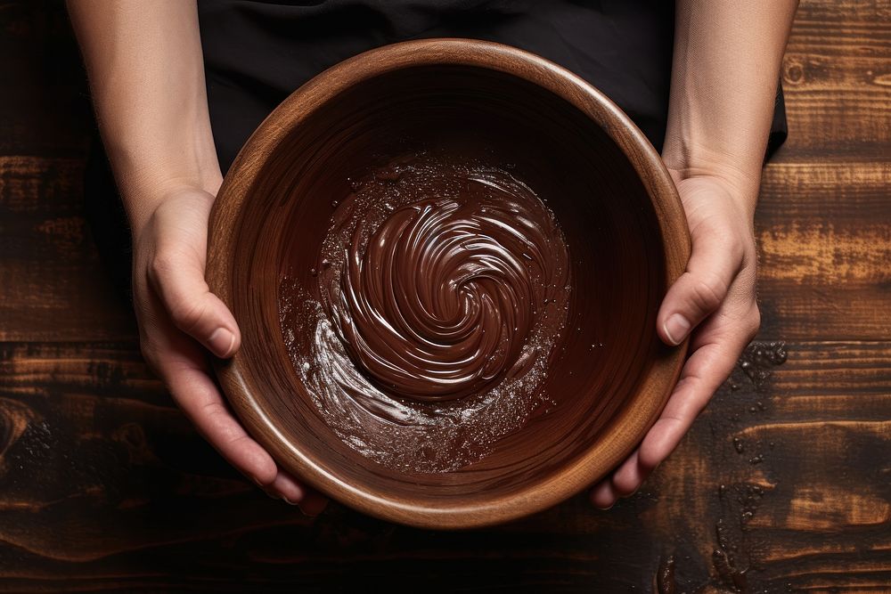 Chocolate holding hand bowl. AI generated Image by rawpixel.