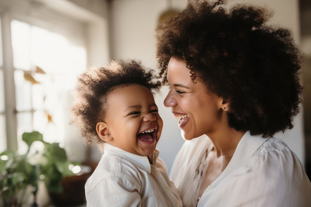 Laughing baby cheerful adult. 