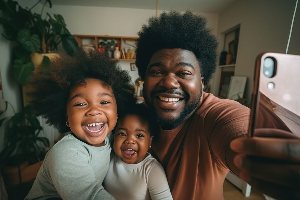 Happy African American family taking selfie. 