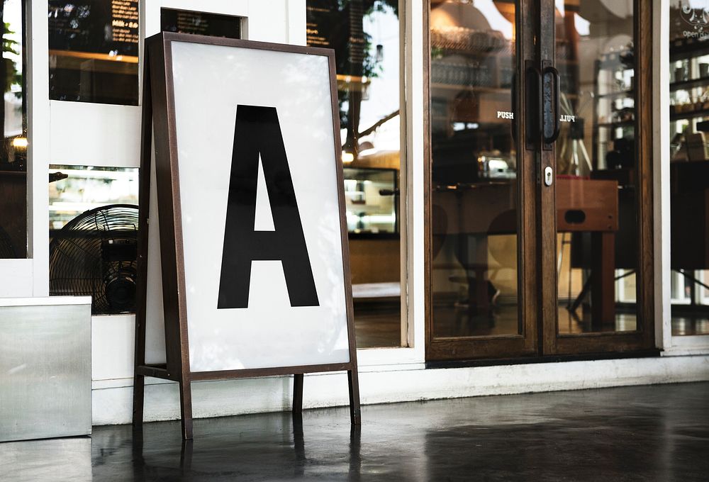 Blank mockup board in front of a restaurant