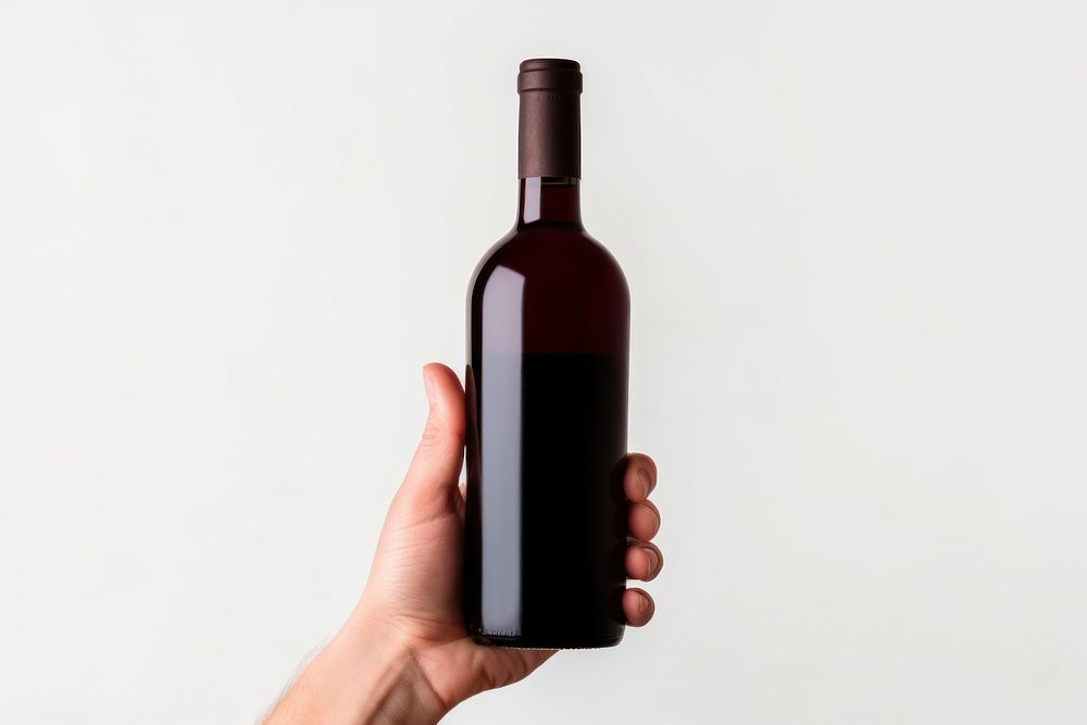 Bottle wine holding drink. AI generated Image by rawpixel.