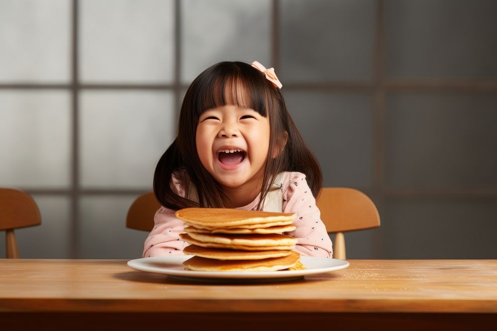 Pancake eating child table. AI generated Image by rawpixel.