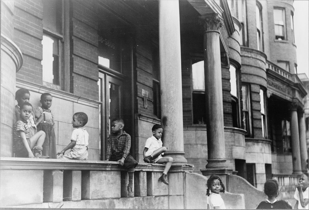 Children in front of apartment buildings in the better section of the Black Belt, Chicago, Illinois. Sourced from the…