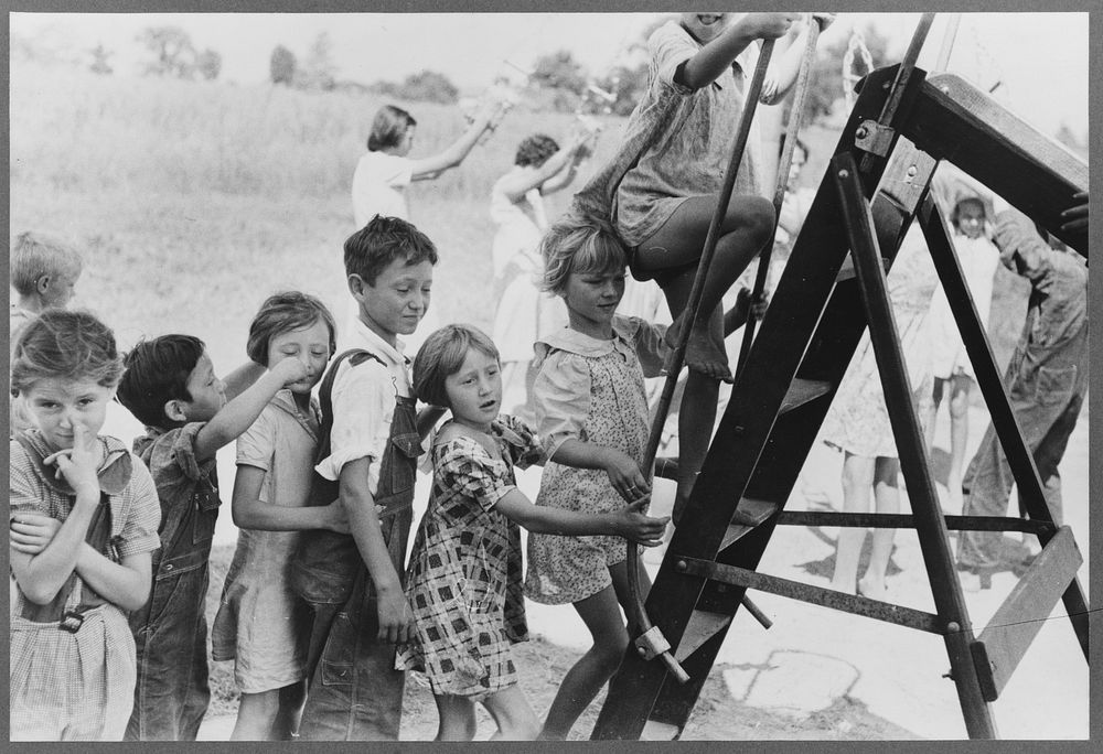 Farm children climbing chute-the-chutes, Southeast Missouri Farms Project school by Russell Lee