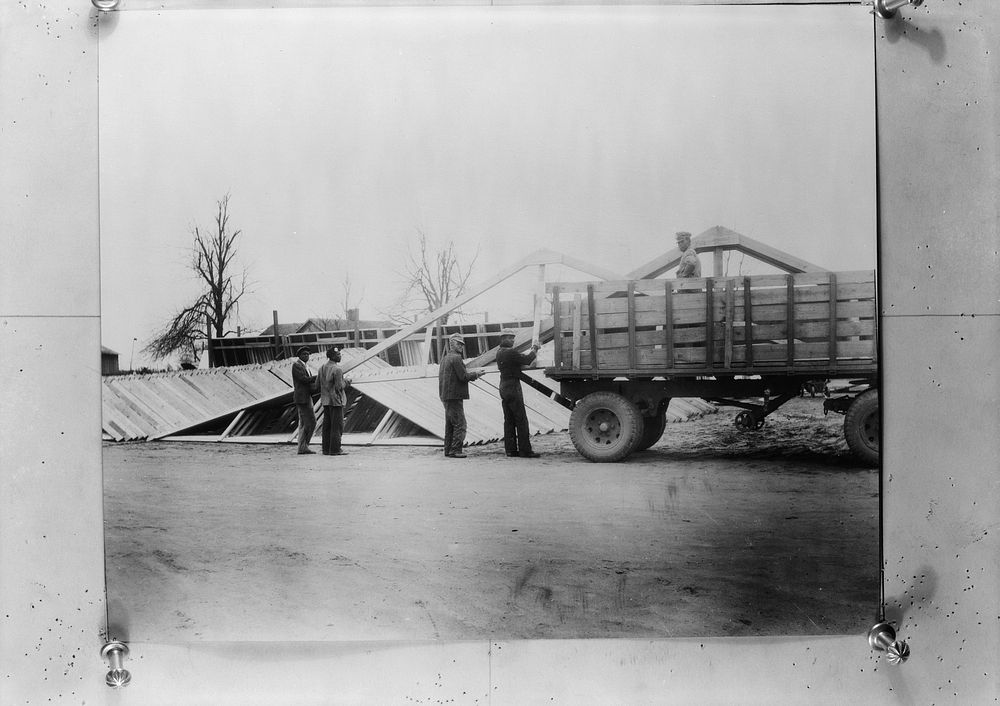 Prefabricated sections being loaded on a truck. La Forge, Missouri by Russell Lee