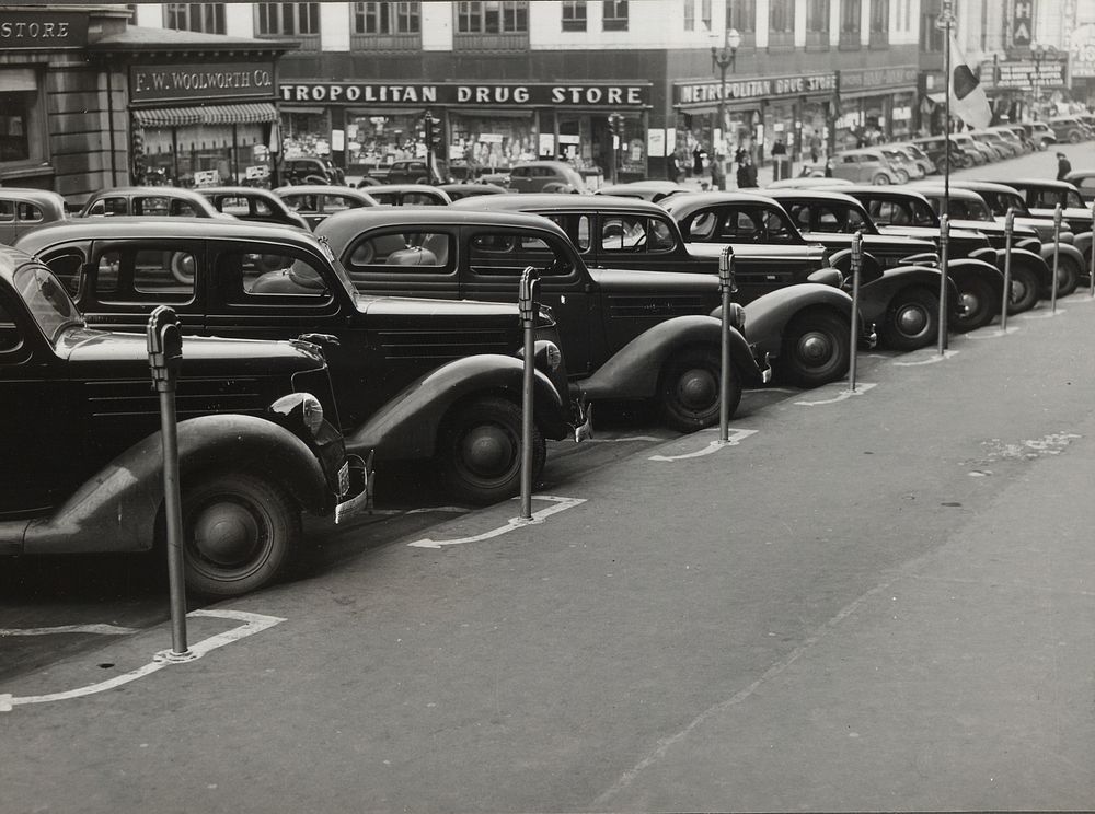 Cars parked diagonally along parking meters. Omaha, Nebraska. Sourced from the Library of Congress.