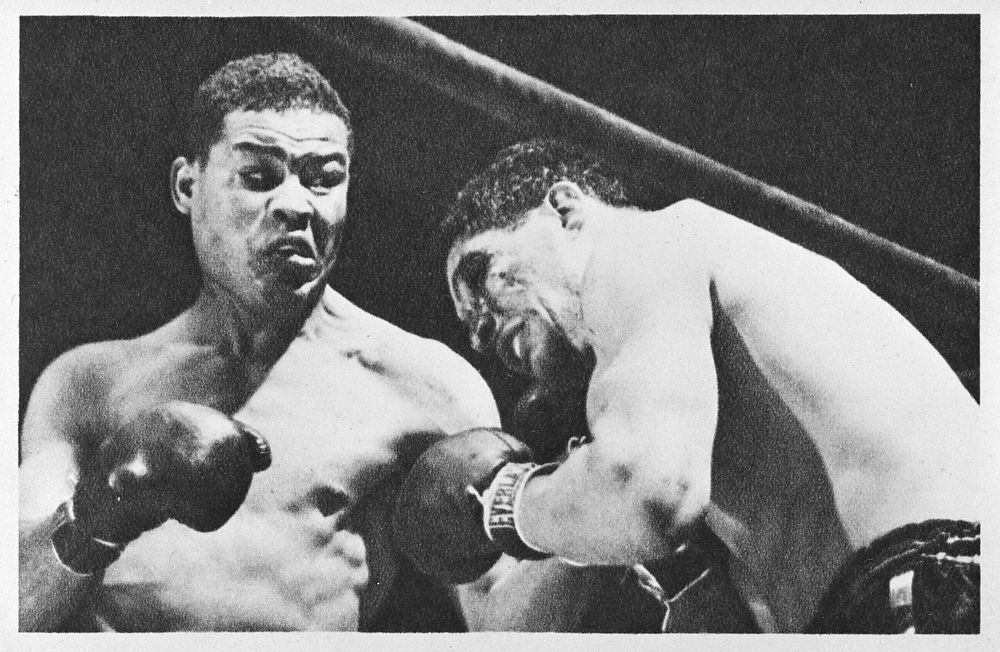 [Untitled photo shows: Joe Louis lands a punch against Arturo Godoy during the fight at Yankee Stadium, Bronx, New York.].…