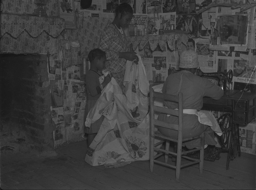 Sewing a quilt. Gees Bend, Alabama. Sourced from the Library of Congress.