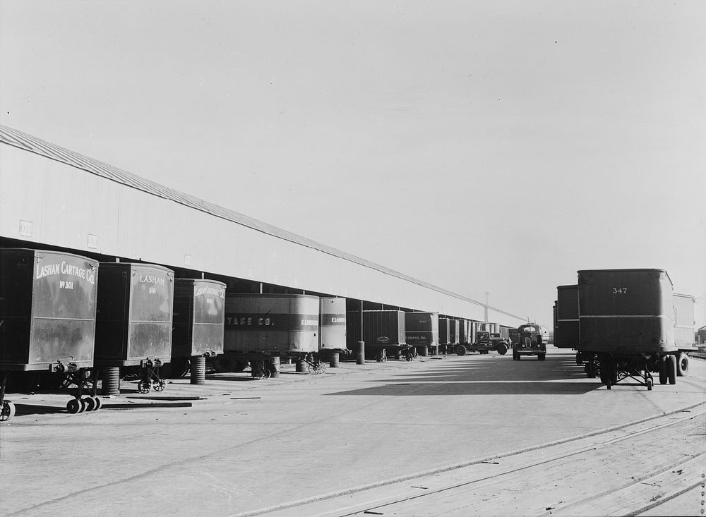 Chicago, Illinois. Truck trailers lined up to load and unload goods at a Chicago and Northwestern Railroad yard. Sourced…