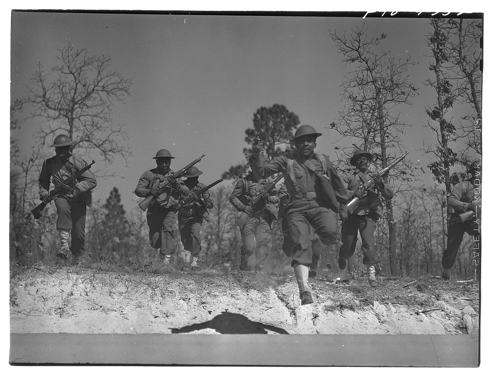 Fort Bragg, North Carolina. Sergeant Williams leading his platoon in charge. Sourced from the Library of Congress.