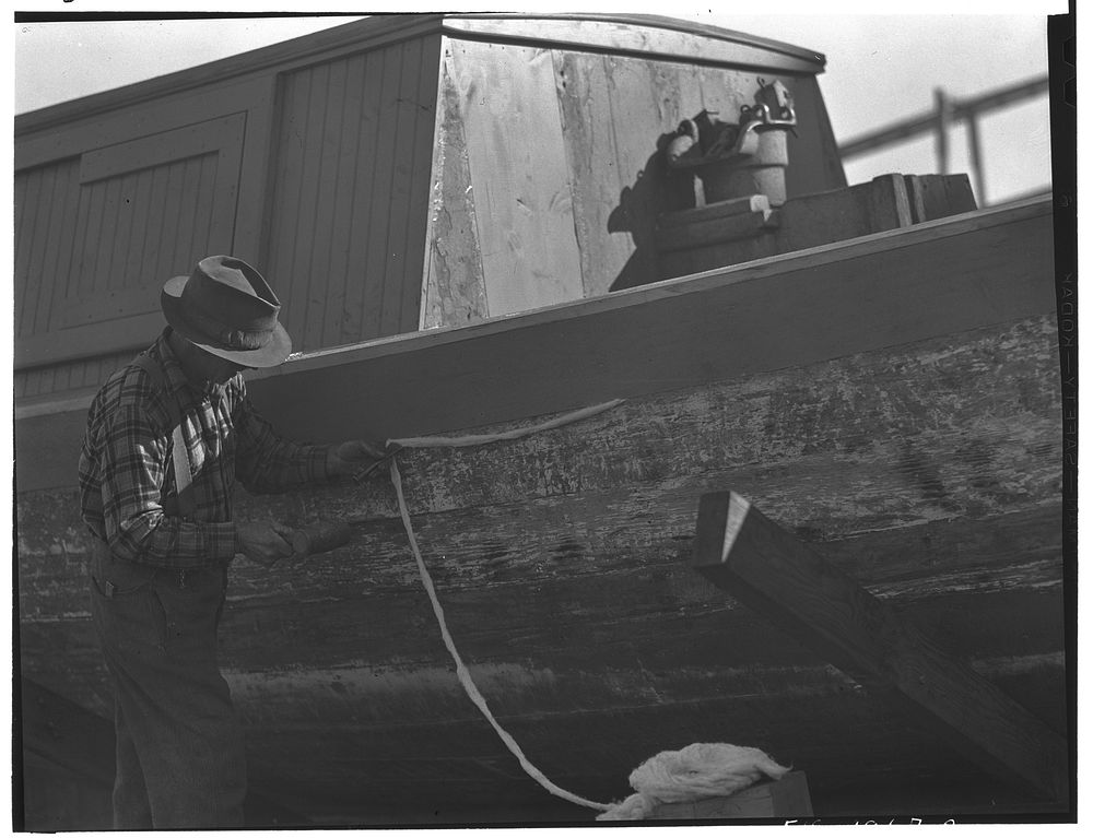 Provincetown, Massachusetts. Portuguese workmen caulking a hull. Sourced from the Library of Congress.