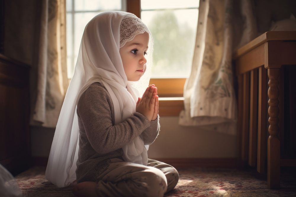 Toddler sitting praying contemplation. AI generated Image by rawpixel.