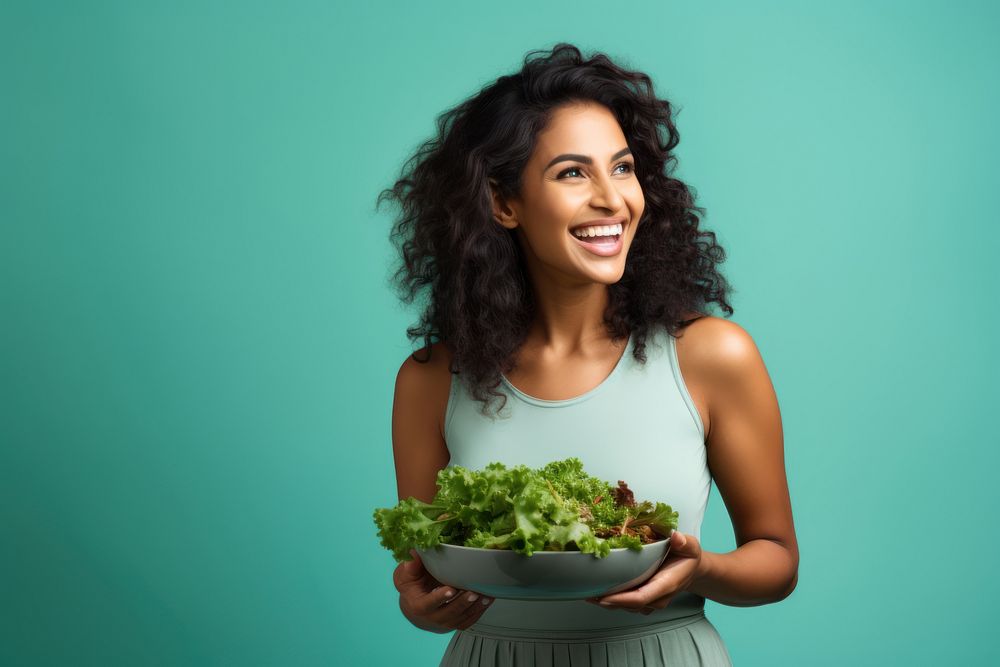 Laughing portrait eating salad. 