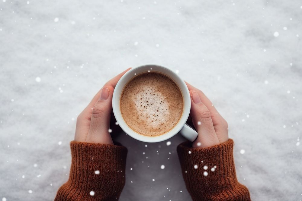 Coffee cup holding drink. 