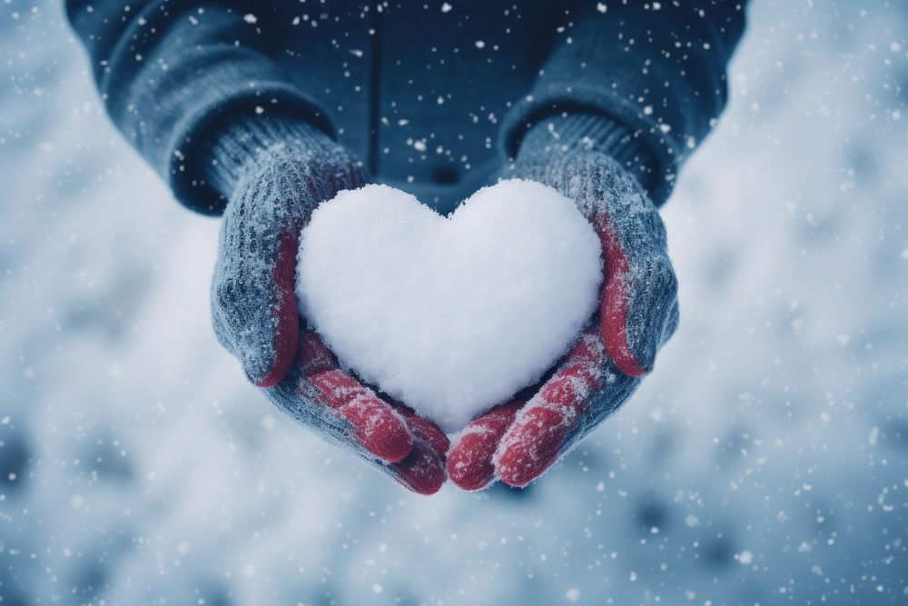 Holding glove heart snow. AI generated Image by rawpixel.