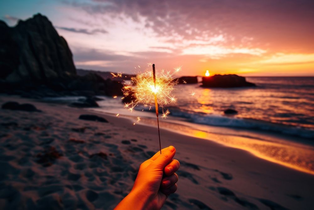Beach hand celebration sparkler. AI generated Image by rawpixel.