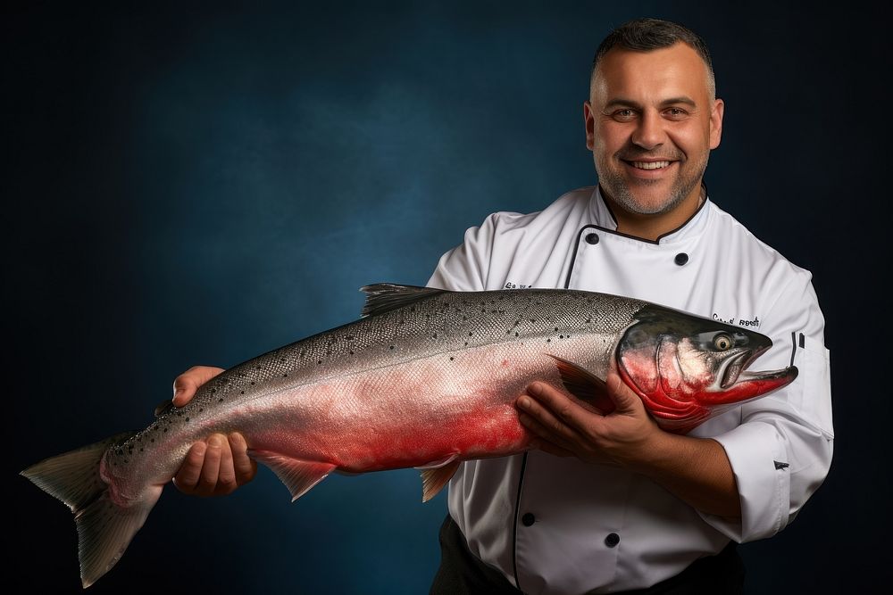 Holding adult chef fish. 