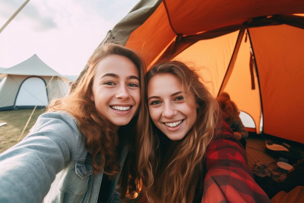 Selfie tent laughing outdoors. 