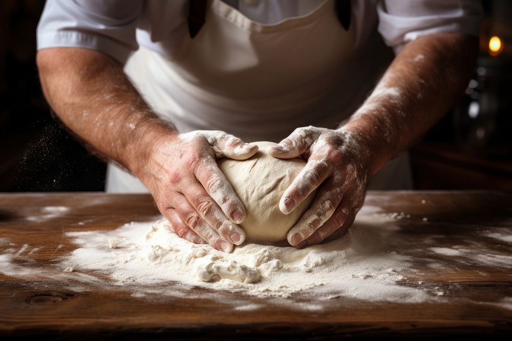 Cooking person flour dough. 