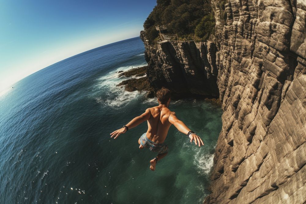 Cliff swimming outdoors jumping. AI generated Image by rawpixel.