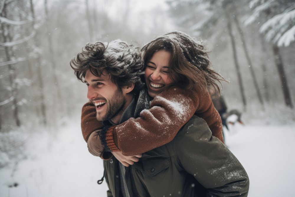 Snow laughing outdoors hugging. AI generated Image by rawpixel.