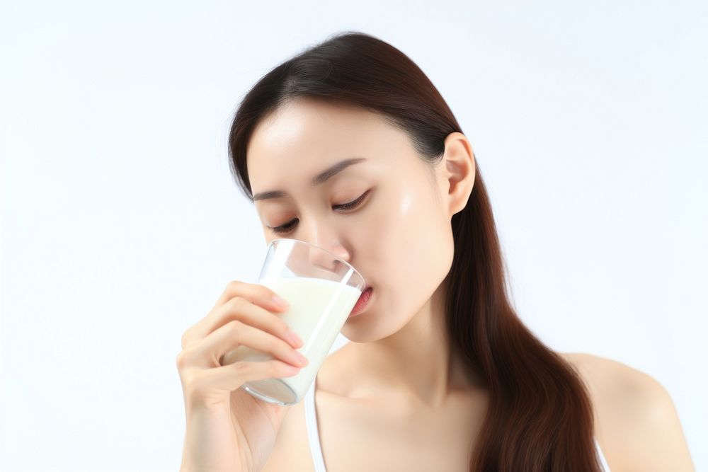 Drinking milk white background refreshment. AI generated Image by rawpixel.